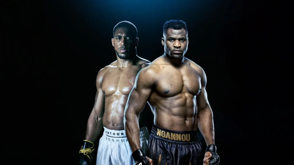 Two professional boxers wearing gloves, Anthony Joshua v Francis Ngannou, standing in front of a black background.